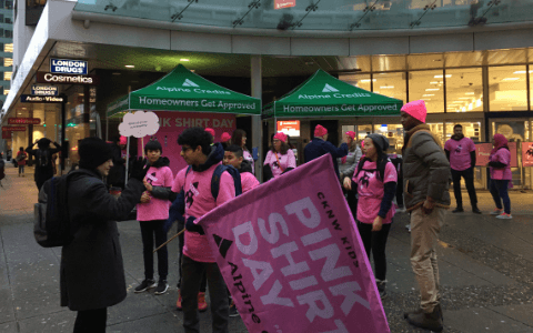 Volunteers calling for donations on the road for pinkshirtday anti-bullying campaign